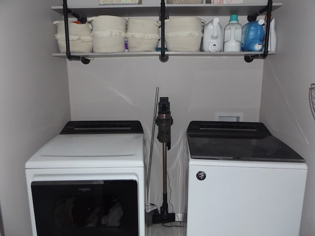 washroom featuring washer and dryer