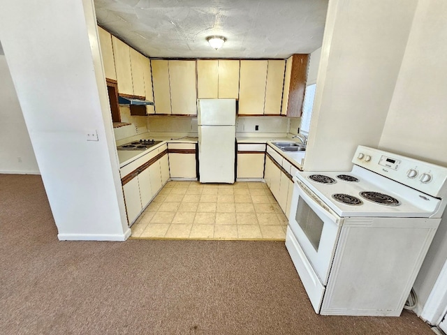 200 Fries Rd, Galax, VA 24333 - kitchen featuring white appliances, light countertops, under cabinet range hood, and light carpet