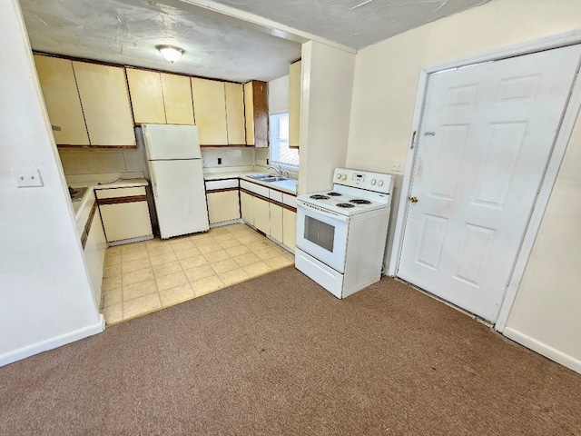 200 Fries Rd, Galax, VA 24333 - kitchen with white appliances, light countertops, and light colored carpet