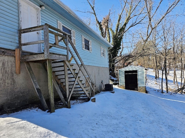 200 Fries Rd, Galax, VA 24333 - view of snowy exterior featuring a storage unit and stairs
