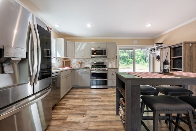 1610 Pope Rd, Ivanhoe, VA 24350 - kitchen with appliances with stainless steel finishes, gray cabinetry, crown molding, tasteful backsplash, and open shelves