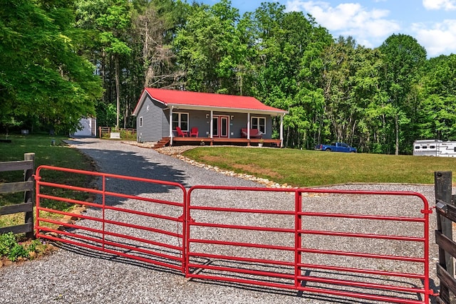 1610 Pope Rd, Ivanhoe, VA 24350 - view of front facade with covered porch, a metal roof, and a gate