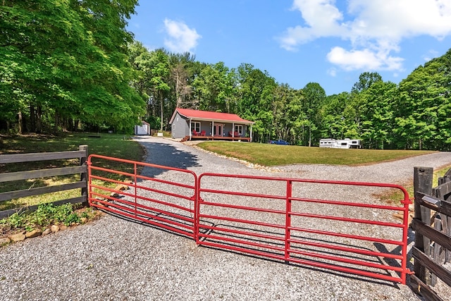 1610 Pope Rd, Ivanhoe, VA 24350 - gate with covered porch and a wooded view