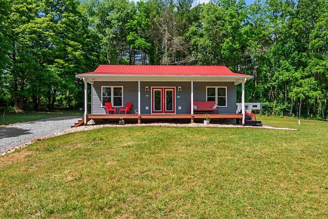 1610 Pope Rd, Ivanhoe, VA 24350 - view of front facade with covered porch, a front yard, a metal roof, and crawl space