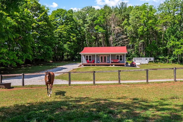 1610 Pope Rd, Ivanhoe, VA 24350 - view of front of home featuring a metal roof, french doors, and gravel driveway
