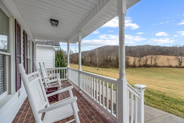 exterior space featuring a porch and a mountain view