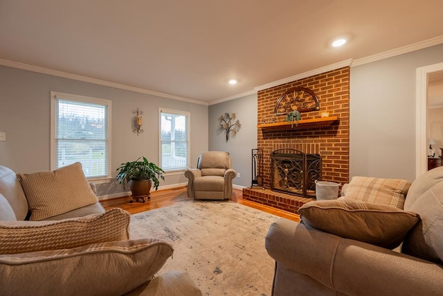 living area featuring ornamental molding, a fireplace, and wood finished floors