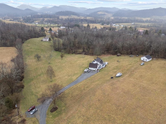 drone / aerial view featuring a rural view and a mountain view