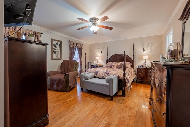 bedroom with light wood-style floors, multiple windows, and crown molding