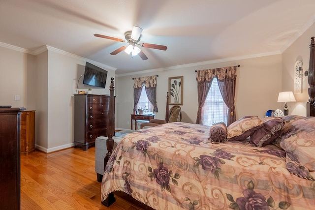 bedroom with ornamental molding, light wood-type flooring, ceiling fan, and baseboards