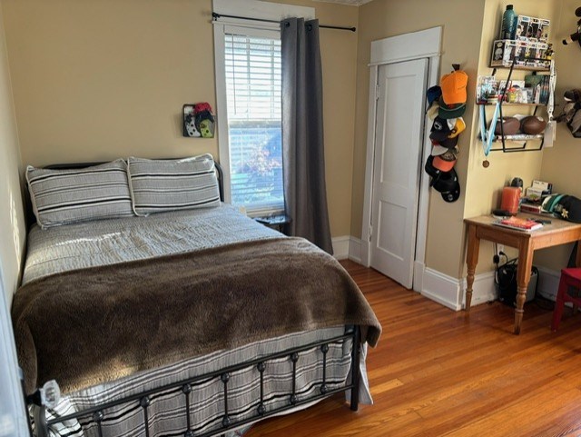 bedroom featuring a closet and light wood-type flooring