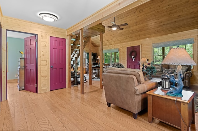 558 Pops Peak Rd, Fancy Gap, VA 24328 - living room featuring wood walls, plenty of natural light, wood finished floors, and a ceiling fan
