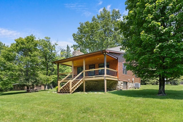 558 Pops Peak Rd, Fancy Gap, VA 24328 - rear view of property featuring a chimney, log veneer siding, a lawn, and stairs