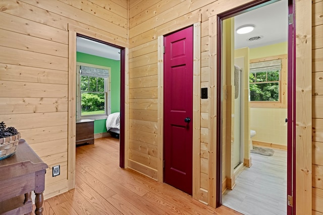 558 Pops Peak Rd, Fancy Gap, VA 24328 - hall featuring light wood finished floors and wooden walls