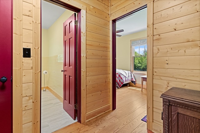 558 Pops Peak Rd, Fancy Gap, VA 24328 - corridor with light wood-style floors and wood walls