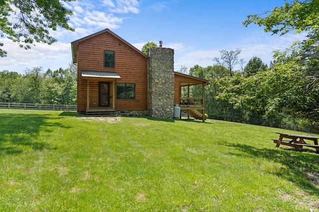 558 Pops Peak Rd, Fancy Gap, VA 24328 - rear view of property featuring a chimney, faux log siding, and a metal roof