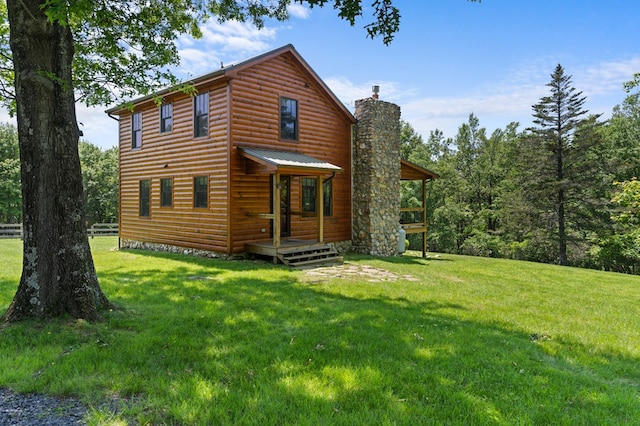 558 Pops Peak Rd, Fancy Gap, VA 24328 - view of front of home featuring a chimney, faux log siding, a front lawn, and a deck