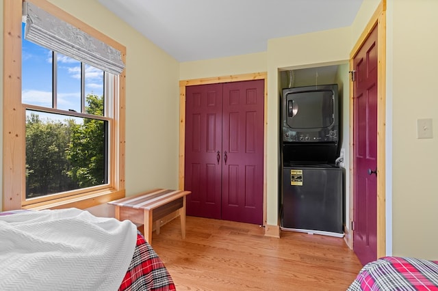 558 Pops Peak Rd, Fancy Gap, VA 24328 - bedroom with stacked washer / dryer and light wood-style floors