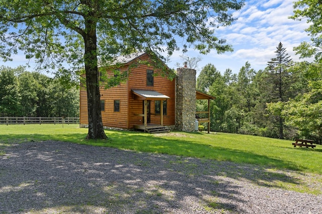 558 Pops Peak Rd, Fancy Gap, VA 24328 - view of front of house featuring a chimney, faux log siding, a deck, and a metal roof