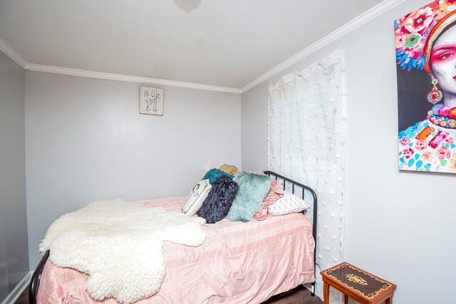 bedroom with crown molding