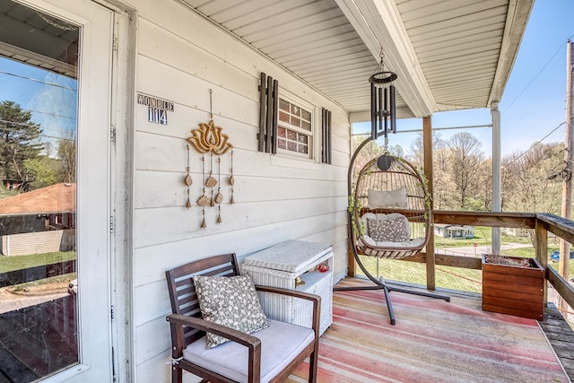 wooden terrace featuring covered porch