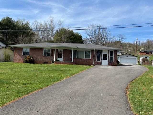 4127 Steelsburg Hwy, Cedar Bluff, VA 24609 - ranch-style house featuring a detached garage, brick siding, a front lawn, and an outdoor structure