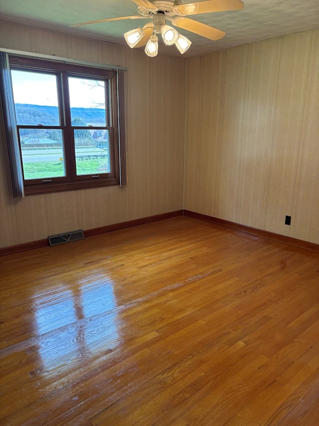 4127 Steelsburg Hwy, Cedar Bluff, VA 24609 - empty room featuring wood finished floors, baseboards, and ceiling fan