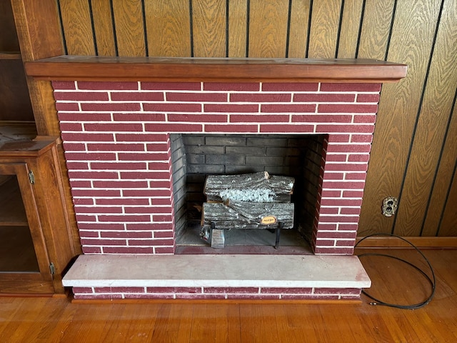 4127 Steelsburg Hwy, Cedar Bluff, VA 24609 - detailed view of a brick fireplace and wood finished floors