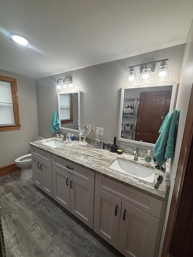 1105 N Main St, Hillsville, VA 24343 - bathroom featuring double vanity and wood finished floors