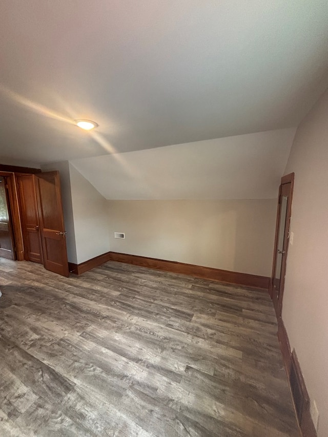 1105 N Main St, Hillsville, VA 24343 - additional living space with vaulted ceiling and dark wood-style floors