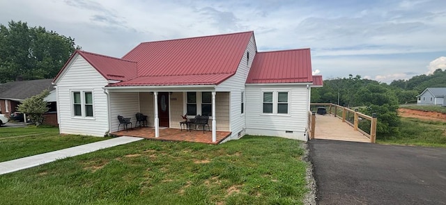 1105 N Main St, Hillsville, VA 24343 - view of front of property featuring a front yard, covered porch, crawl space, and a metal roof