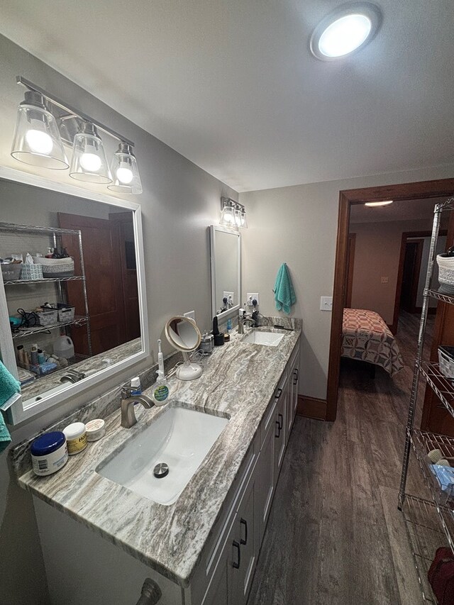 1105 N Main St, Hillsville, VA 24343 - ensuite bathroom featuring double vanity and wood finished floors