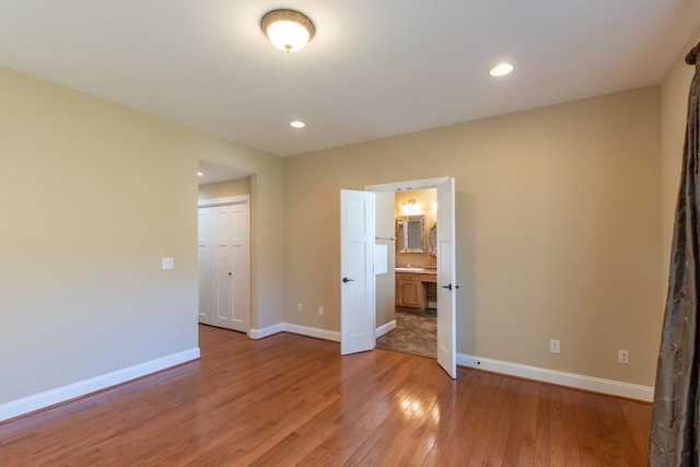 16084 Old Jonesboro Rd, Bristol, VA 24202 - unfurnished bedroom featuring light wood finished floors, recessed lighting, ensuite bath, and a closet
