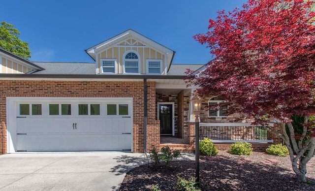 16084 Old Jonesboro Rd, Bristol, VA 24202 - view of front of house featuring a porch, concrete driveway, brick siding, and roof with shingles