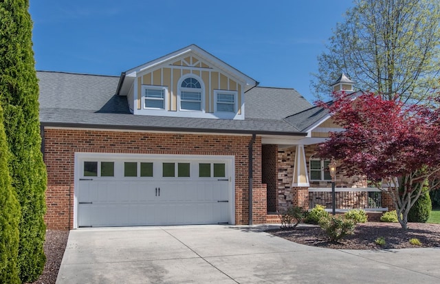 16084 Old Jonesboro Rd, Bristol, VA 24202 - view of front of house with concrete driveway, covered porch, brick siding, and a shingled roof