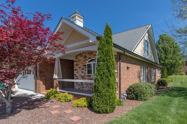 16084 Old Jonesboro Rd, Bristol, VA 24202 - view of property exterior featuring covered porch, brick siding, and a yard