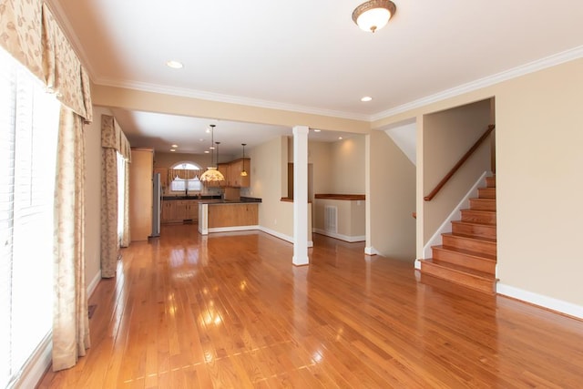 16084 Old Jonesboro Rd, Bristol, VA 24202 - unfurnished living room featuring light wood-style flooring, recessed lighting, ornamental molding, and stairs