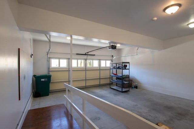 16084 Old Jonesboro Rd, Bristol, VA 24202 - garage featuring baseboards and a garage door opener