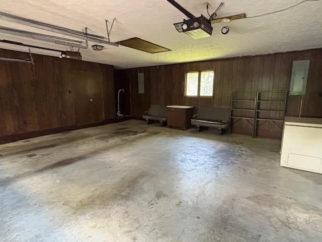 319 Bogey Dr, Abingdon, VA 24211 - garage with wooden walls and a garage door opener