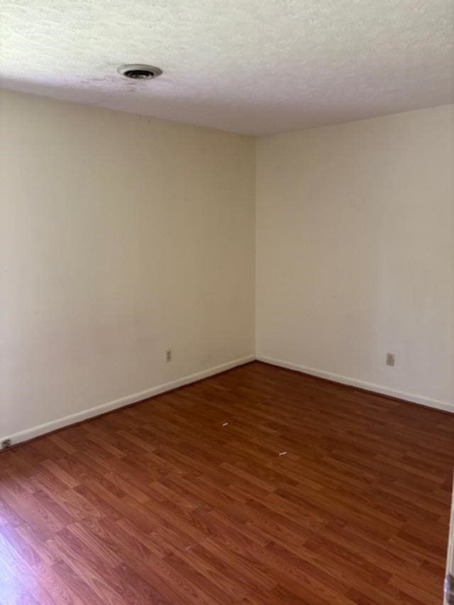 319 Bogey Dr, Abingdon, VA 24211 - empty room with wood finished floors and a textured ceiling