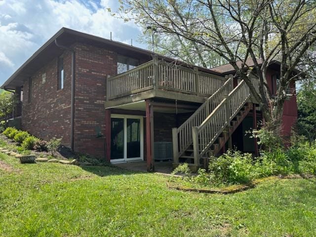 319 Bogey Dr, Abingdon, VA 24211 - back of house featuring brick siding, a yard, a deck, and stairway