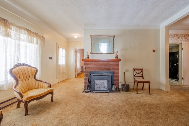 sitting room featuring crown molding, light carpet, and a textured ceiling