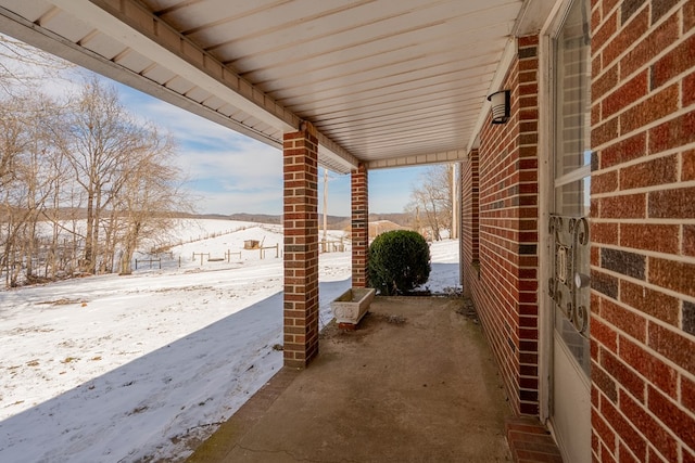 view of snow covered patio