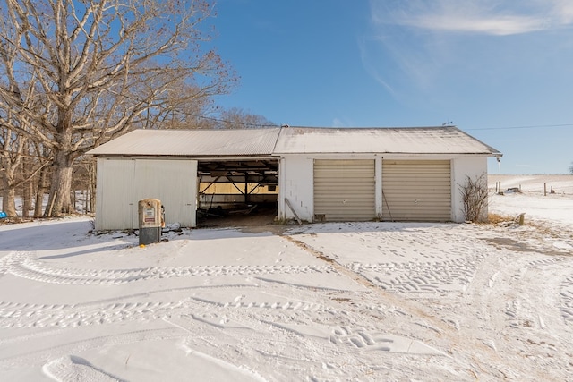 view of snow covered garage