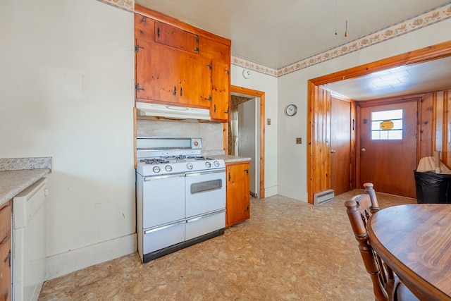 kitchen with white appliances and decorative backsplash