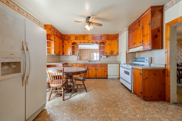 kitchen with white appliances, decorative backsplash, and ceiling fan