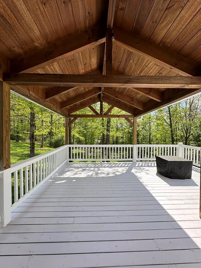 wooden deck featuring view of wooded area