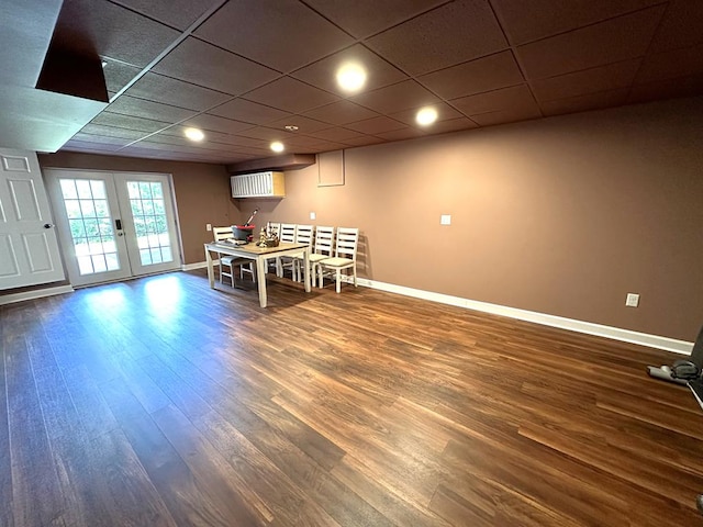 dining room featuring baseboards, dark wood-style flooring, french doors, and a paneled ceiling