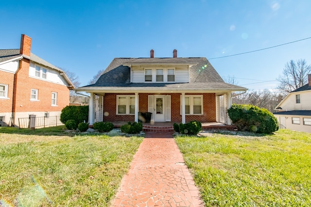 bungalow-style house featuring a front yard and a porch