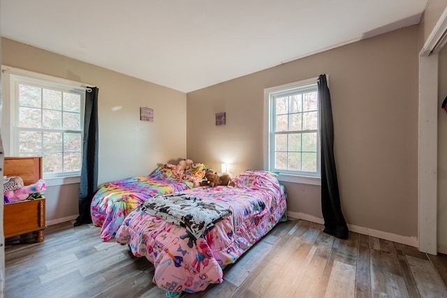 bedroom with wood-type flooring